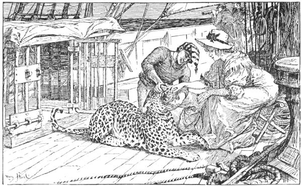 A sailor helps his keeper give Saï his medicine